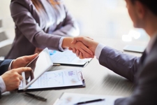 property division lawyer shaking hands with client